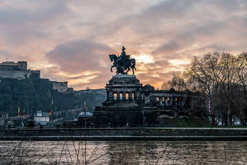 Colorful Sunrise burning sky Koblenz City historic monument German Corner where river rhine and...