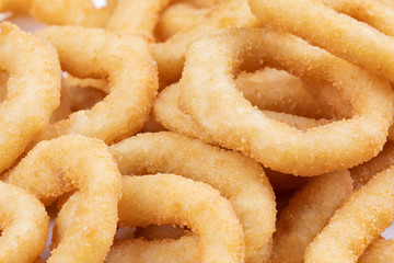 Close up of delicious onion rings on a plate