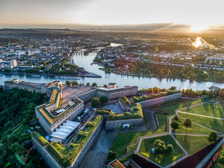 Aerial View of Ehrenbreitstein fortress and Koblenz City in Germany during sunset - obrazy, fototapety, plakaty