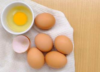 Close-up view of raw chicken eggs on background