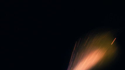 Macro photo of Bonfire sparks. Fire Flames bursts, blasts. Explosion micro sparkles. Mini...
