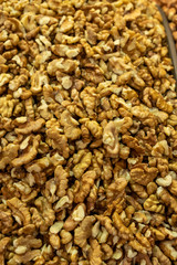 Background made of nuts. Peeled walnuts in the market. Healthy, wholesome food. Organic products. Source of vitamins and minerals. Grocery market in Georgia.
