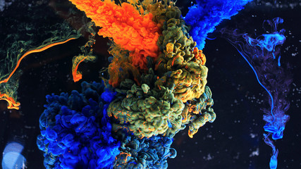Macro photo shoot of colorful Ink in water. Power magic multi color Underwater Paint Drops...