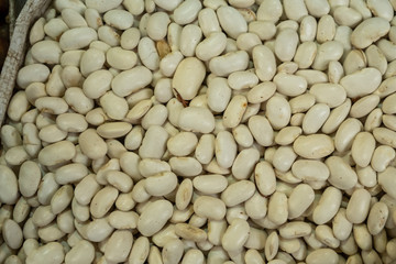 Abstract background from bean kernels. Legume in the market. Natural products for a healthy diet. Protein, a protein from nature. Red, white, colorful, pink beans.