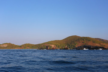 Naklejka premium Island in the sea and bright sky.