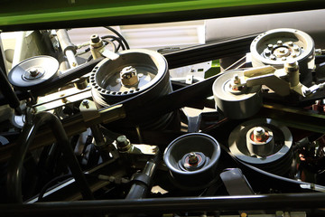 The image of a belt drive modern combine.