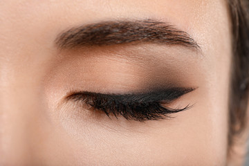 Eye of young woman with beautiful makeup, closeup