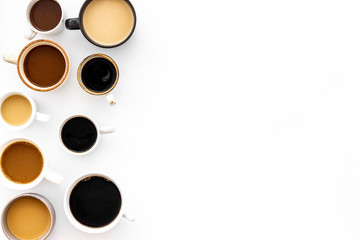 Many cups of coffee on white table top-down copy space