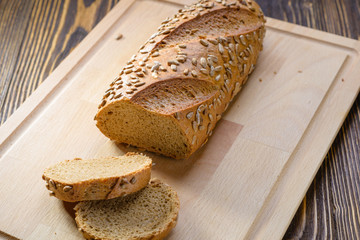 sliced bread with seeds on a cutting board