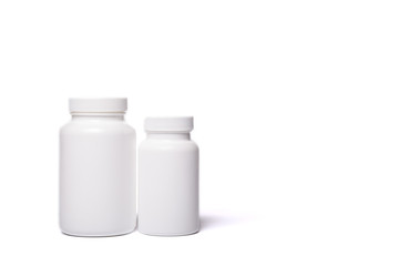 Two white containers for tablets