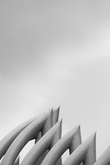 Obraz premium minimalism rising part of white curve cement architecture construction light and shadow abstract background