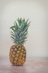 A pineapple minimalist photo with yellow tones