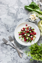Baked beets with feta cheese and shoots of young peas