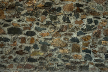 Background stone wall with splashes of ocher and gray