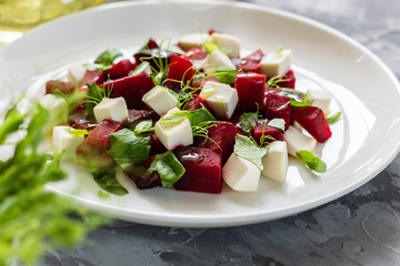 Baked beets with feta cheese and shoots of young peas