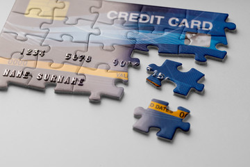 Credit card on jigsaw puzzle for Online shopping concept