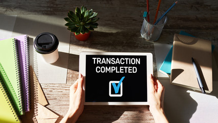 Transaction completed message on screen. Digital banking and online payment concept.