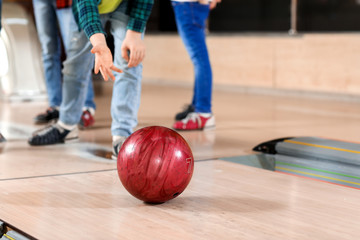 Fototapeta premium Little children playing bowling in club