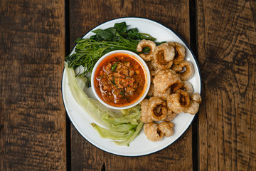 Crispy pork and chili paste and blanched vegetables in a dish