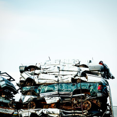 Crushed cars at a car wrecking yard