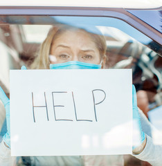 woman in the car. Help me. Car. Stay home. COVID-19. 