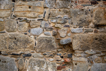 A wall of natural -or sandstone as background or texture