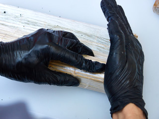 Cook hands making sushi roll closeup photo
