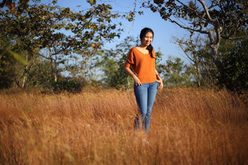 Women enjoying grasslands at Pha Taem National Park, Ubon Ratchathani, Thailand