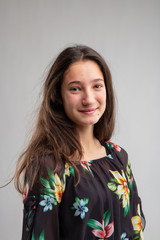 Happy friendly young woman in a floral top