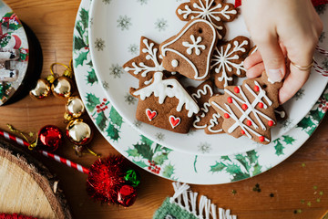 Woman grabbing a Christmas cookie