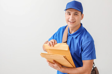 Postman with letters on light background