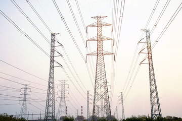 high voltage pole on sky sunset background.