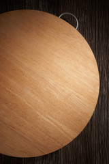 Wooden cutting board, tray on table