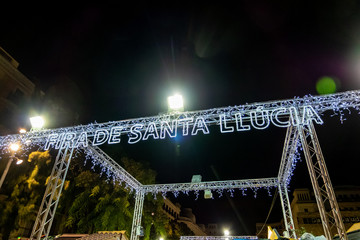 Santa Llucia christmas market at night in Barcelona, Catalonia, Spain. - obrazy, fototapety, plakaty