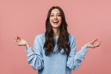 Image of attractive young woman meditating and keeping fingers together