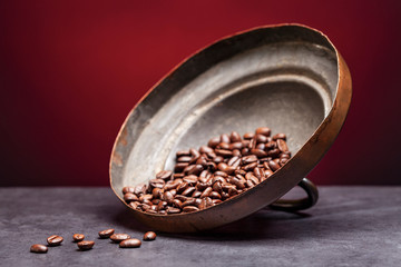 coffee beans on the lid of a coffee pot