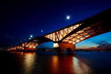 Lighting up bridge over the river 