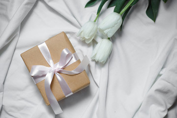 Gift box and flowers. Romantic colorful present.