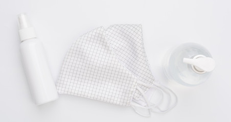 Fabric cloth mask for wearing germ protection  and gel alcohol or hand sanitizer spray bottle for...