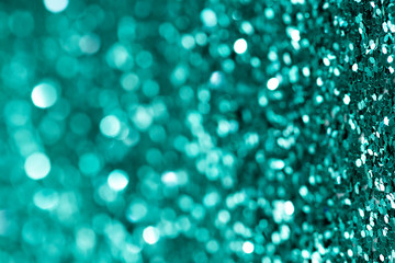 Shiny turquoise glitter textured background