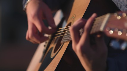Man playing guitar with slow motion shoot music musician classic chord acoustic. Use for...