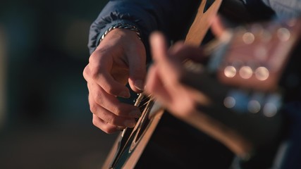 Man playing guitar with slow motion shoot music musician classic chord acoustic. Use for...