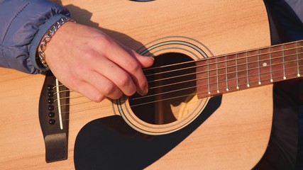 Man playing guitar with slow motion shoot music musician classic chord acoustic. Use for illustration or insert