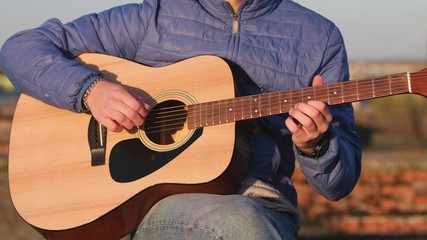 Man playing guitar with slow motion shoot music musician classic chord acoustic. Use for...