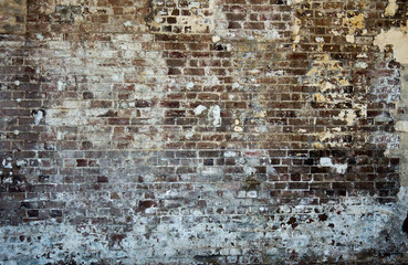 Brick wall background, industrial urban vintage warehouse covered in concrete plaster paint