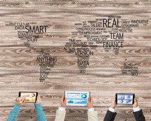 Top view of businesspeople sitting at table and using gadgets