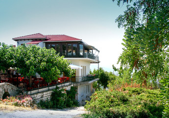 garden with  a beautiful house and flowers at Ioannina citGreecey