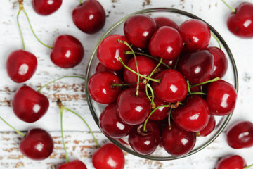 A small glass bowl with ripe fresh cherry	