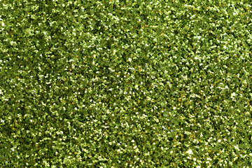 Shiny green glitter textured background