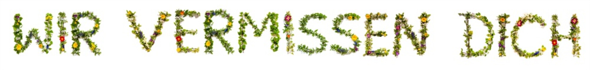 Flower, Branches And Blossom Letter Building German Word Wir Vermissen Dich Means We Miss You. White Isolated Background